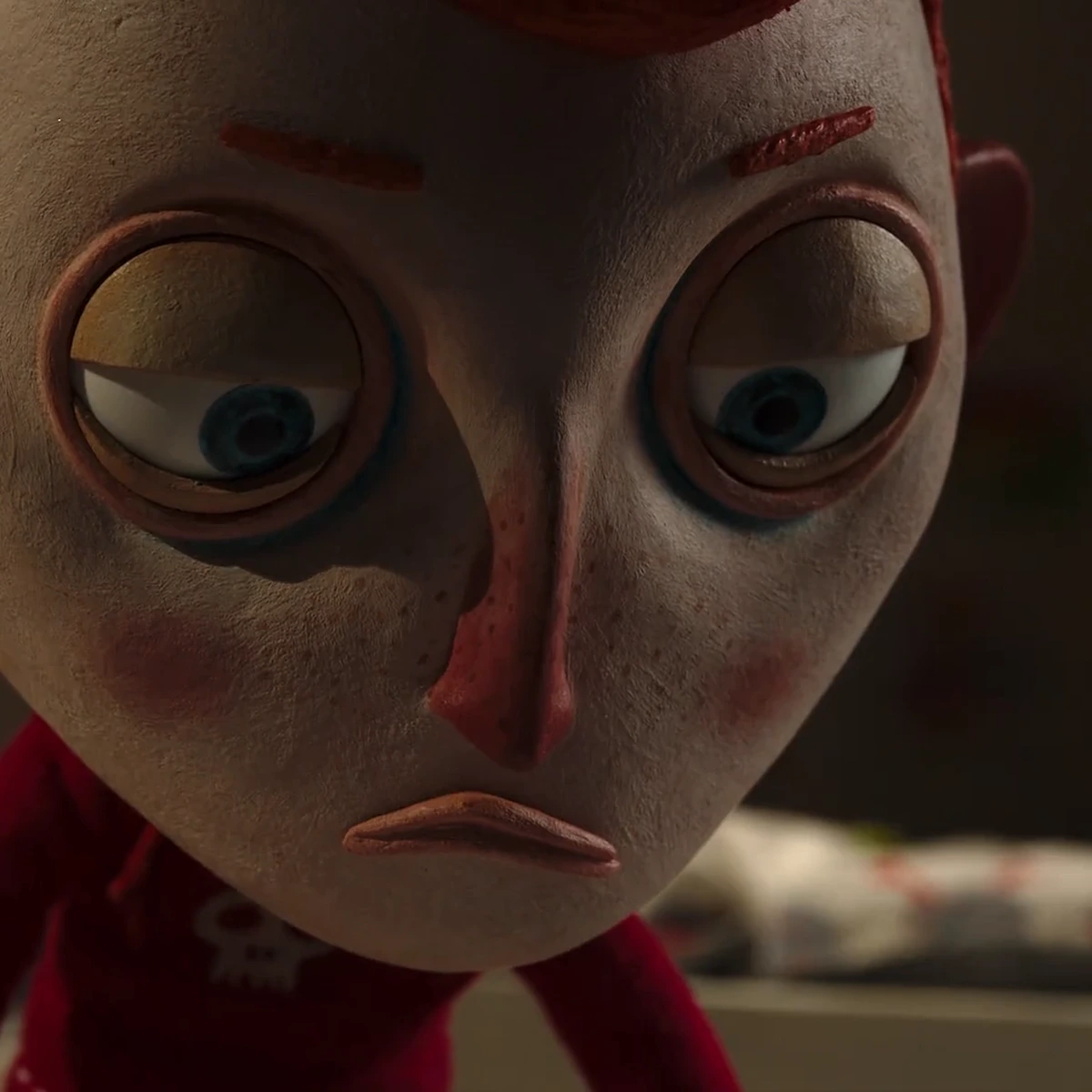 LAIKA-style stop motion: a clay puppet with tool marks and fingerprints still visible in the surface